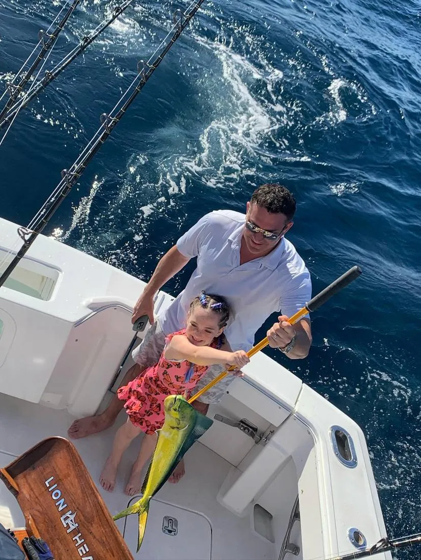 Full limit of mahi-mahi dorado lined up on deck of Lion Heart fishing charter