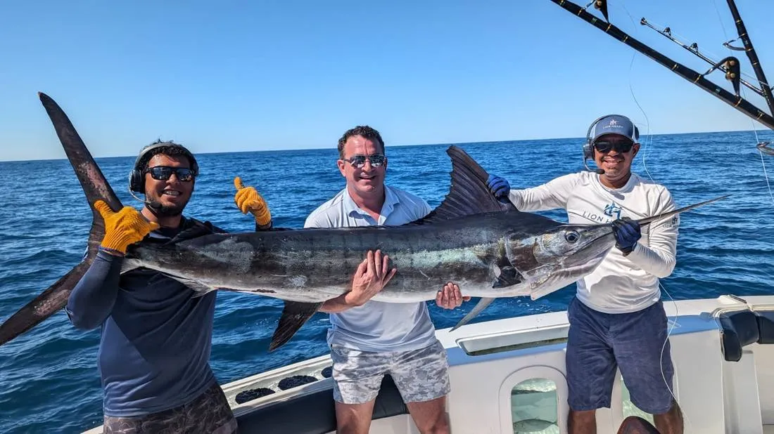 Group of anglers with trophy catch on Lion Heart fishing charter Cabo San Lucas