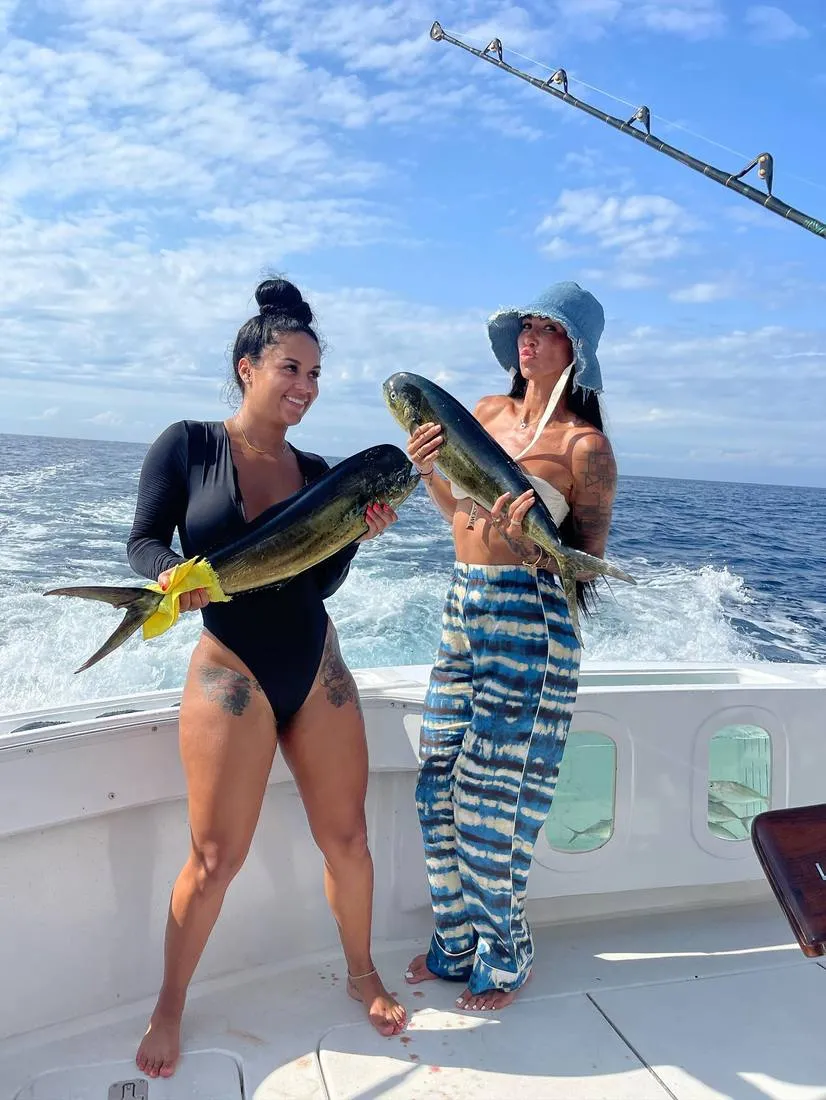 Two female anglers with mahi-mahi dorado on Lion Heart fishing charter Cabo San Lucas