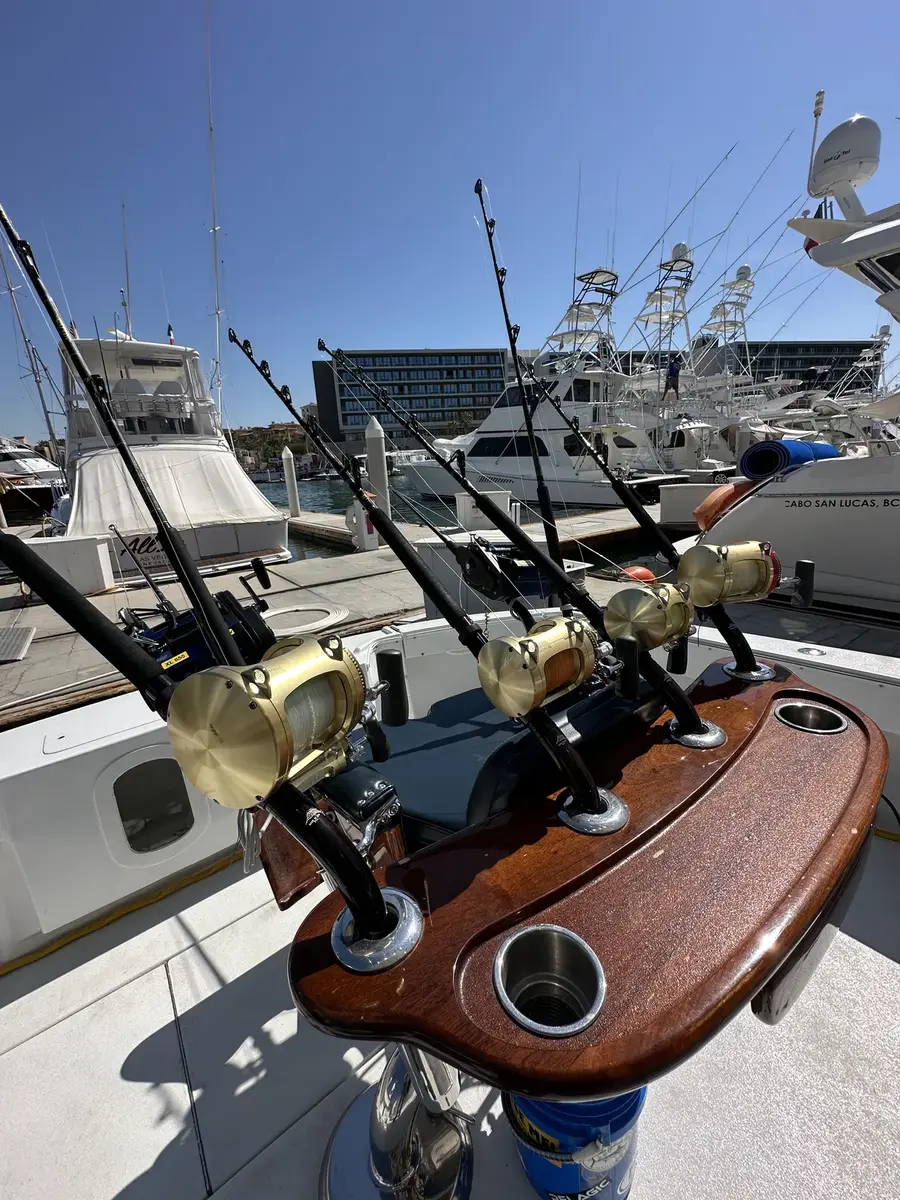 Custom teak rocket launcher and gold big-game reels